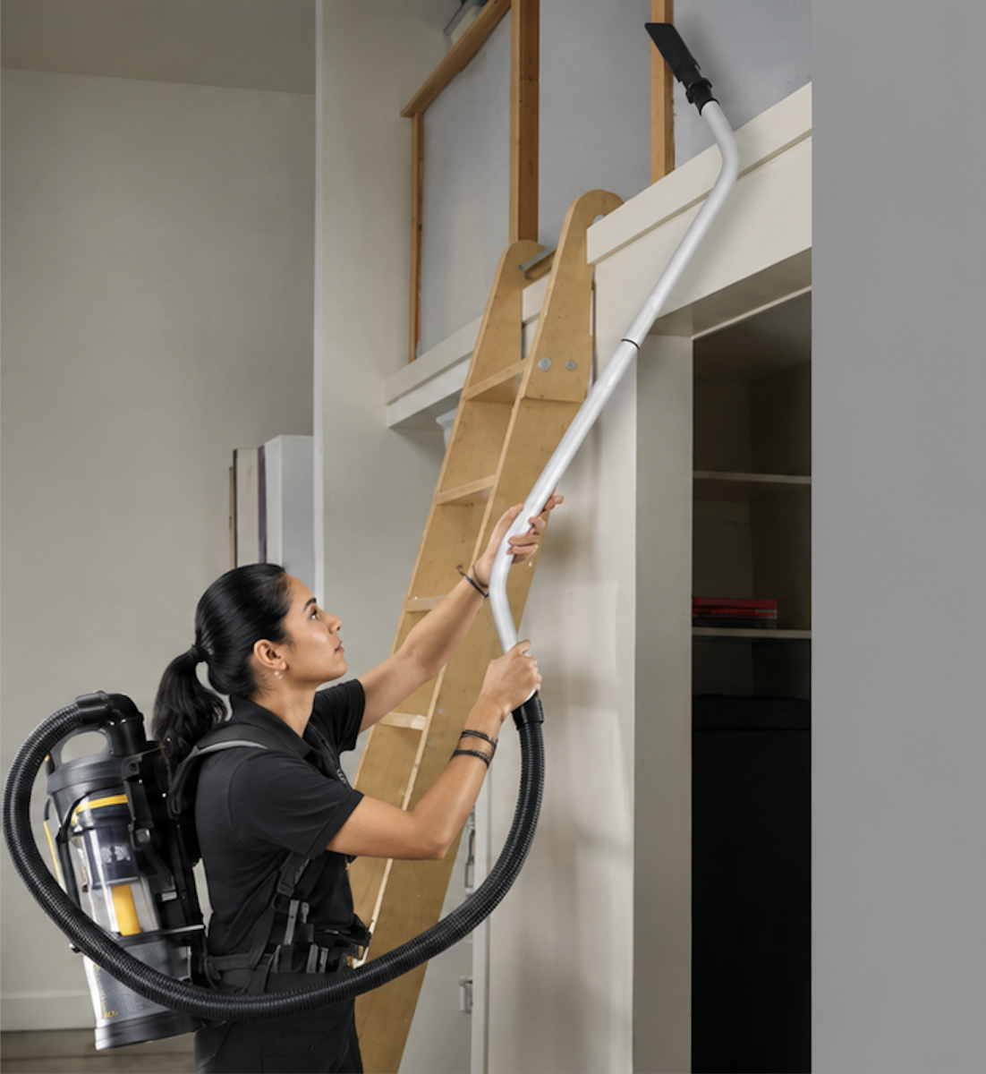Female professional cleaner using the Prolux XForce — designed for pro cleaners, designed for speed